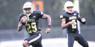 
			
				                                UNC Pembroke’s Sincere Baines runs the ball during an Oct. 14, 2023 game against Fairmont State in Pembroke.
                                 UNCP Athletics

			
		