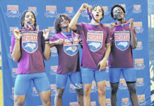 
			
				                                The St. Pauls 4x400 relay team celebrates on the podium after winning the race at the NCHSAA 2A State Championships Friday in Greensboro. Pictured, from left, are Theophilus Setzer, Quintell McNeill, Charles Johnson and Markeon Fletcher.
                                 Contributed photo | Charles Johnson

			
		