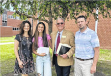 
			
				                                Lumberton Senior High School student Aloña Hanna, second from left, stands Monday during the presentation of the annual Ann Marie Gentry Memorial Scholarship by William Gentry, Ann Marie’s husband, right, Allyson Stanton, her daughter, far left, and Allan Gentry, her son.
 
			
		
