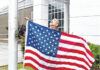 
			
				                                Terry Jackson, director of the COMtech Campus with Robeson Community College, raises a new American flag donated by WoodmanLife Thursday at RCC’s COMtech location.
                                 Cheryl Hemric | For The Robesonian

			
		