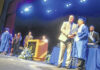 
			
				                                Elvis Gonzalez Morales from St. Pauls High School stands for an official photo with Principal Jason Suggs during graduation ceremonies Friday morning at the University of North Caroilna’s Givens Performing Arts Center. 
                                 David Kennard | The Robesonian

			
		