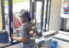 
			
				                                Samaanya Melvin works the drivethru window Thursday at the Dairy Queen on West 5th St. in Lumberton.
                                 David Kennard | The Robesonian

			
		