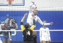 
			
				                                St. Pauls’ Alyssa Monroe (13) spikes the ball over Fairmont’s Paityn Branch (14) during Thursday’s match in St. Pauls.
                                 Chris Stiles | The Robesonian

			
		